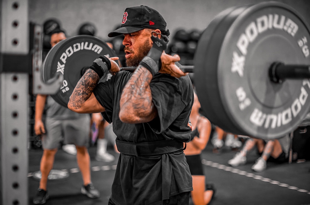 Man doing front squats in crossfit gym in Phuket